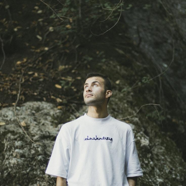 Avery Lin, Lead Design Curator at BloomGardenWay, reviewing corporate floral arrangements
